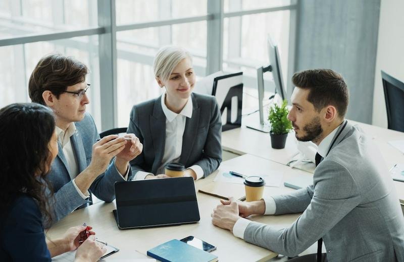 Business team meeting to coordinate a technology project